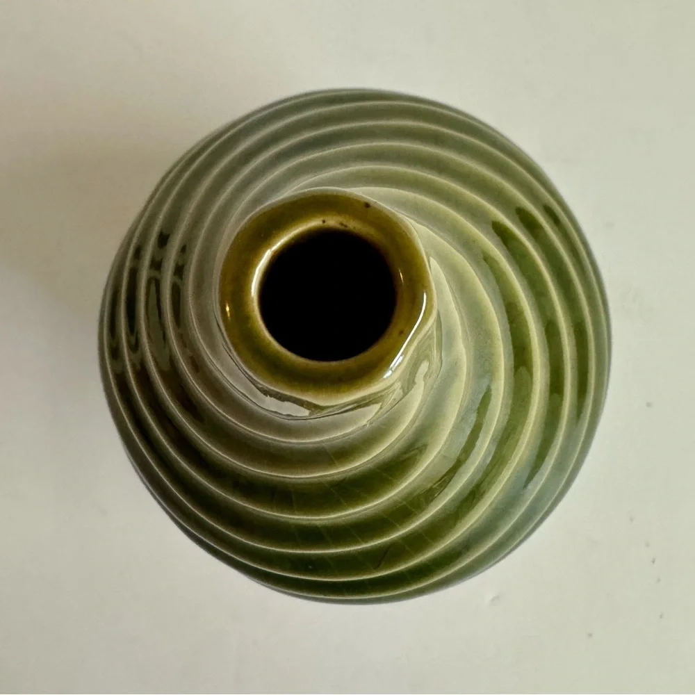 Vintage MCM pottery in earthy sage green  swirl vase.Has crazing.